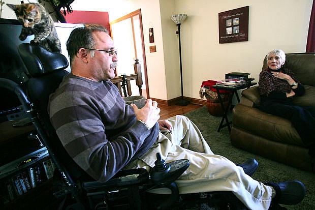 Dan Nelson and his mother, Jean, talk about his medical problems at his home in New Munster. Nelson was hospitalized after a motorcycle accident in 2000, and Dr. Lorraine Novich-Welter had trouble clearing a clog in his tracheotomy tube, depriving him of oxygen. A jury found Novich-Welter negligent, but the Wisconsin Medical Examining Board didn’t discipline her.  