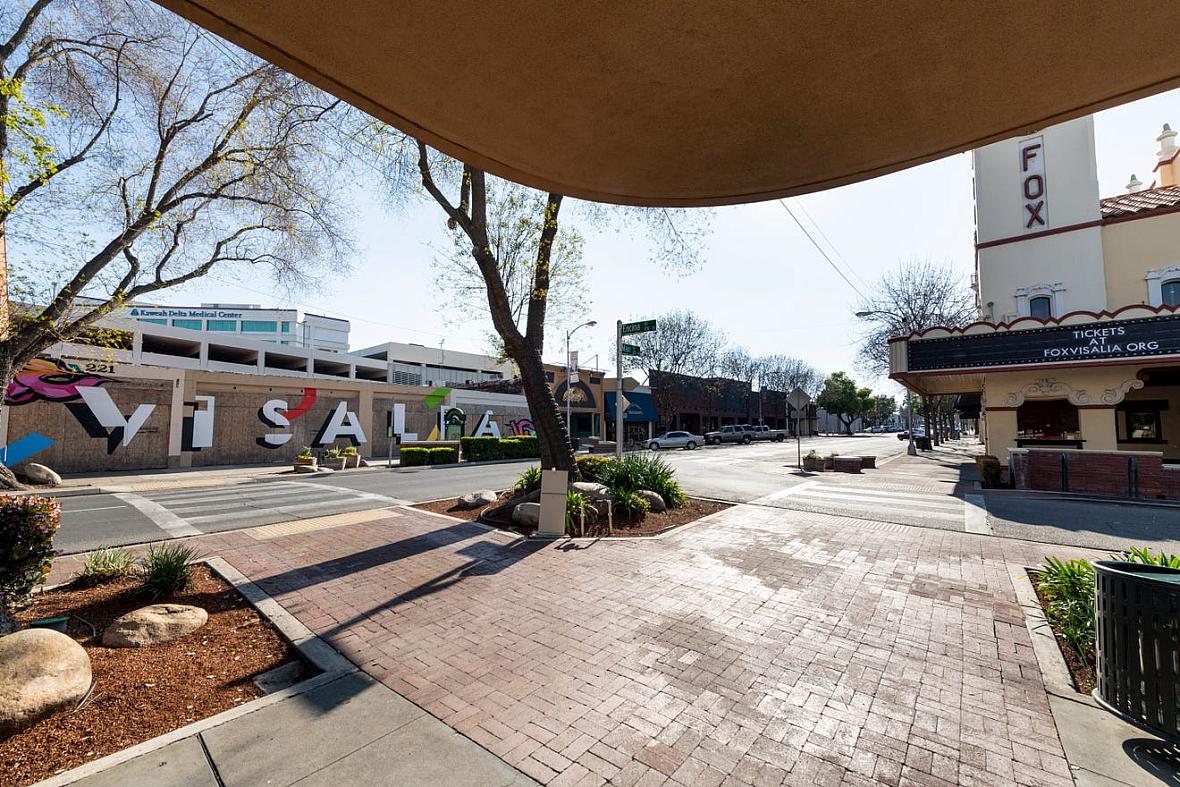 Empty crosswalks and sidewalks are the new norm in Downtown Visalia on Monday, March 30, 2020.