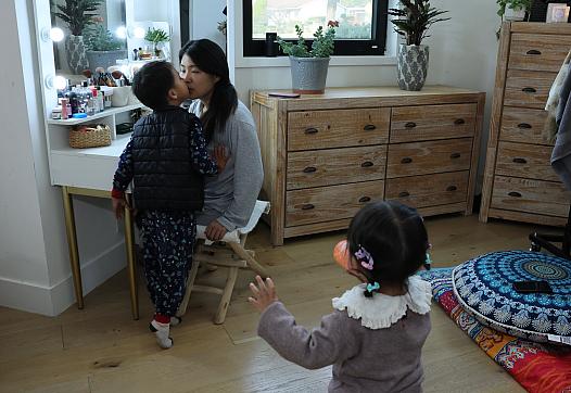 Comedian, actress and postpartum depression survivor Jiaoying Summers with her 4-year-old son and 2-year-old daughter in their home 