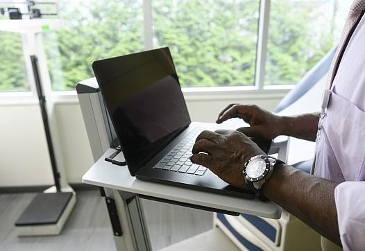 Health provider uses a computer.