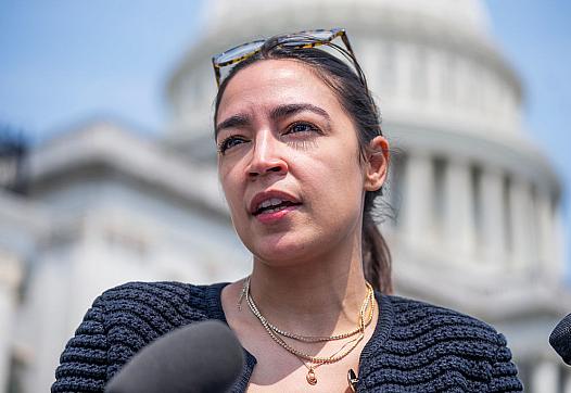 Rep. Alexandria Ocasio-Cortez talks with reporters outside the U.S. Capitol in July.