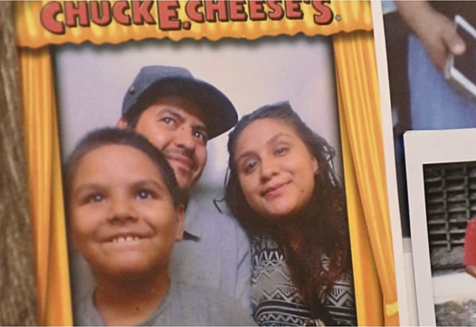 Alma Ramirez, her partner José, and their seven-year-old son at Chuck E. Cheese’s. 