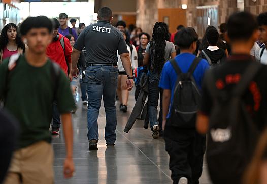People walking through a crowded hallway