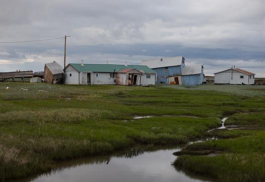 Buildings shorn off their foundations in Kwigillingok, Alaska