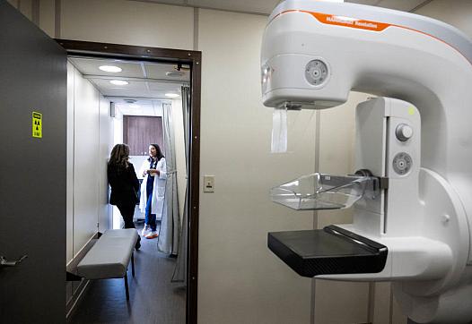 Two people talking in a lab