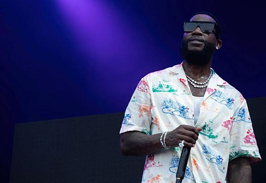 Person with pic in hand and a purple background