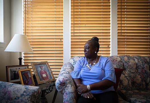 Anita Fisher looks toward a photo of her son at her home in Spring Valley, Aug. 16, 2022.