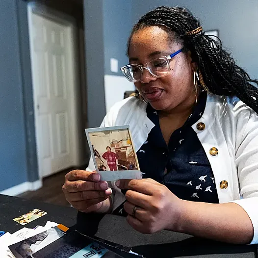 Person looking at a photograph