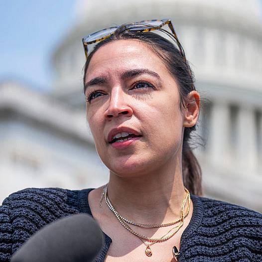 Rep. Alexandria Ocasio-Cortez talks with reporters outside the U.S. Capitol in July.