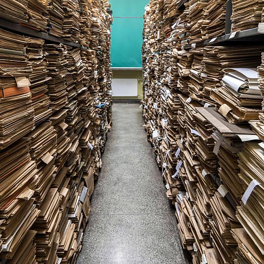 Archival files shown in a room.