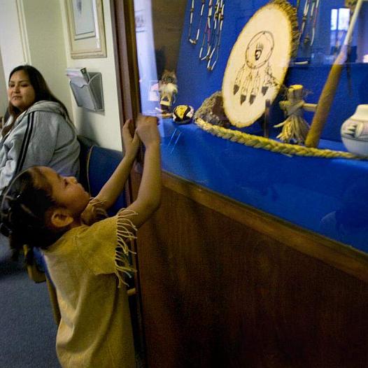 Child looking up at souvenir