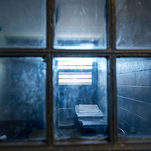 A dark room seen through a window