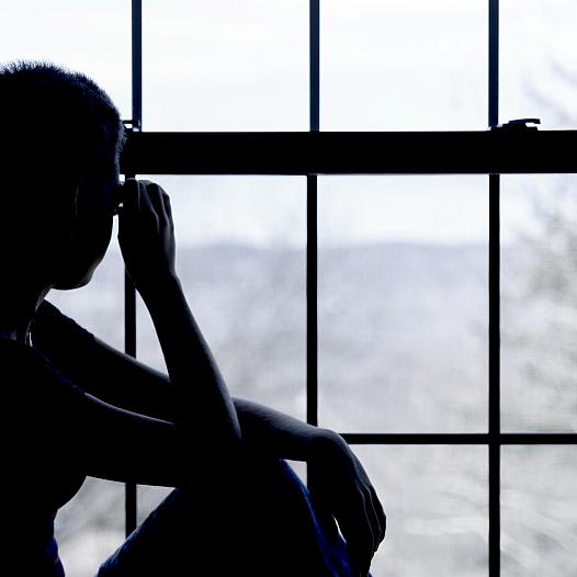 A person sitting by the window 