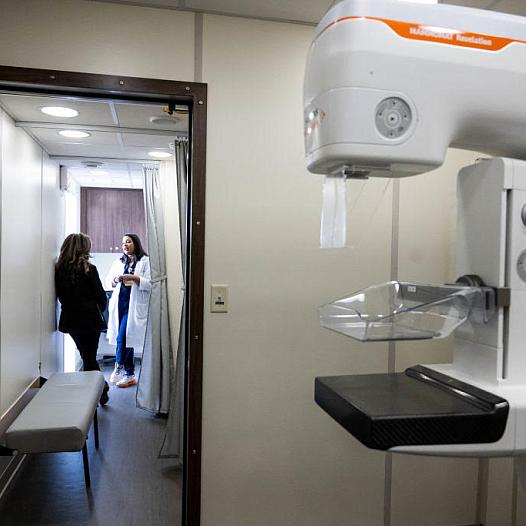 Two people talking in a lab