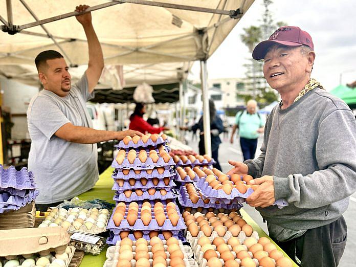 A man at a vegetable stand