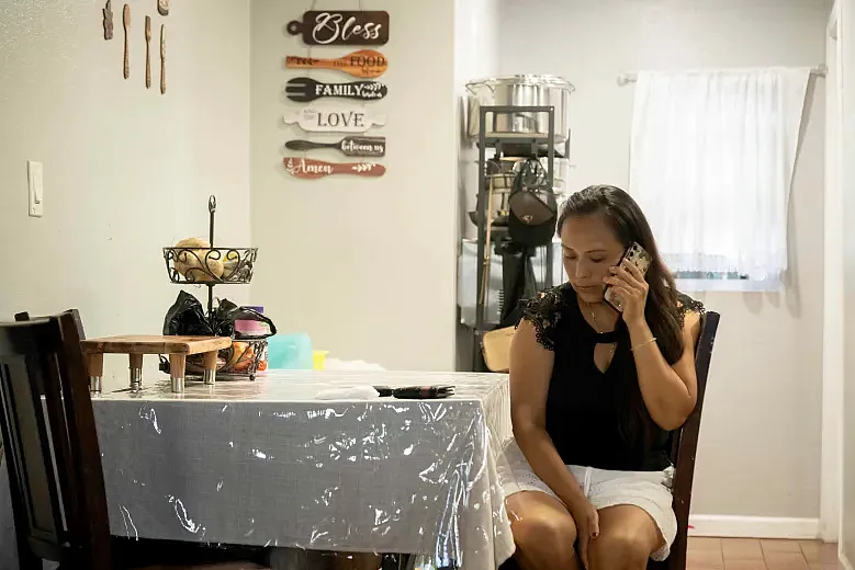 Gabby takes a call from her husband