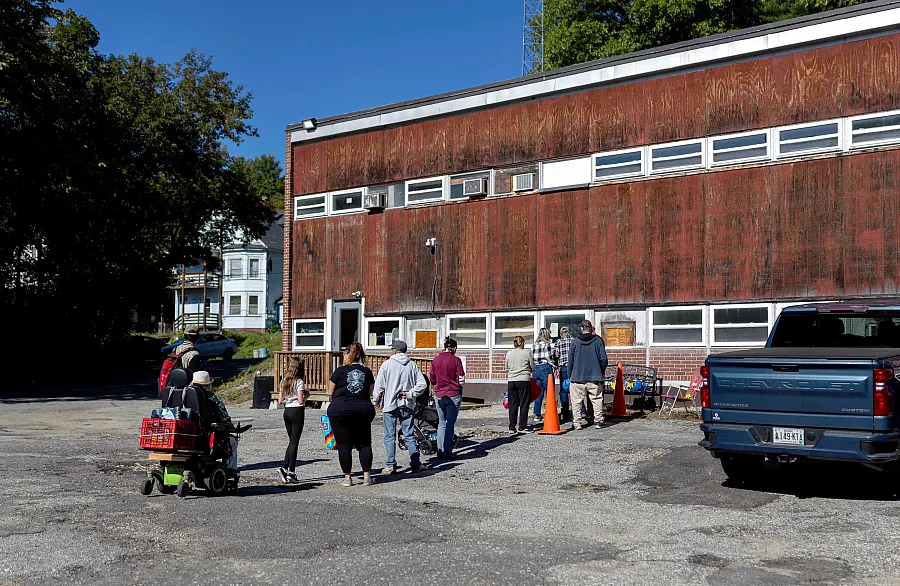 People line up outside of the Old School Food Pantry