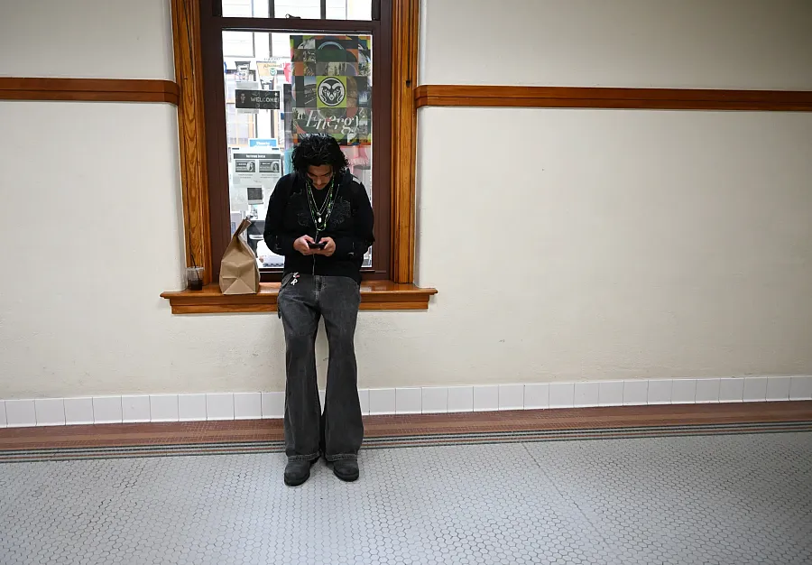 A men standing by a window 