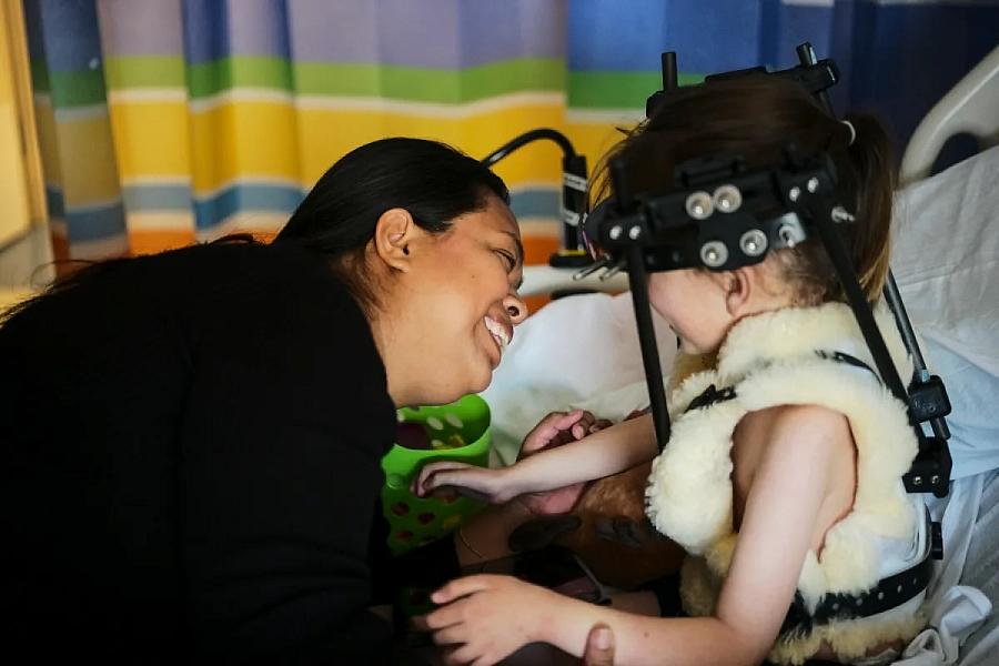 a woman talking to a child