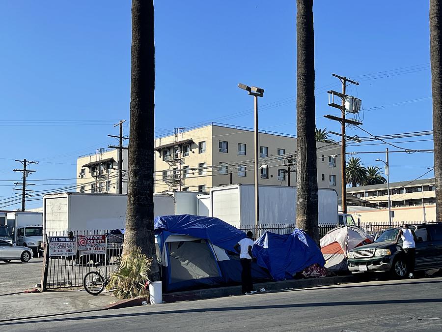 a city view with a homeless tent