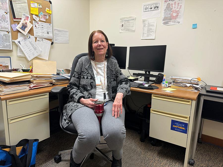 Person sitting in front of a desk