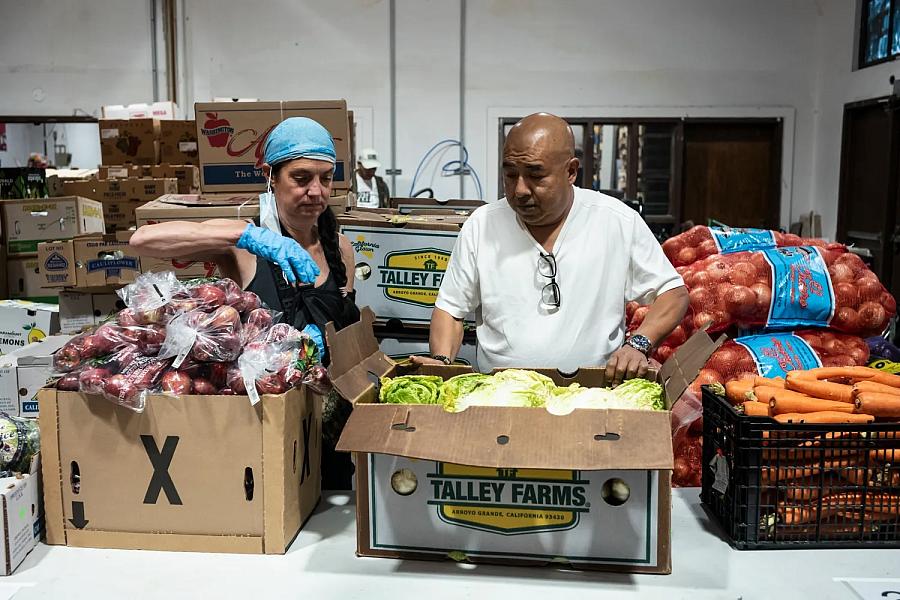two people with boxes of food