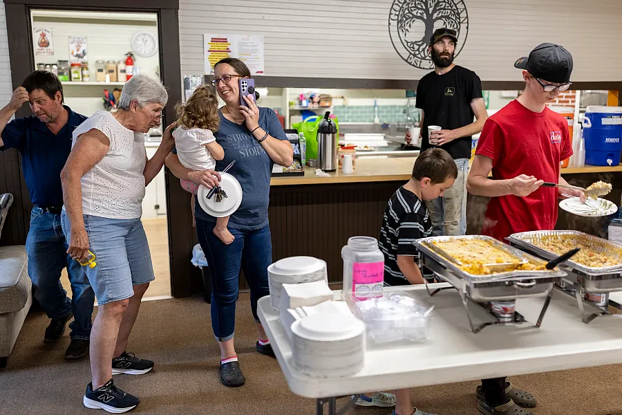 Judy Sanborn greets Alisha Holtorf and her youngest child, Ember