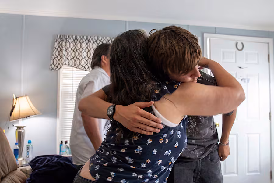 Jaden Flora hugs his grandmothe