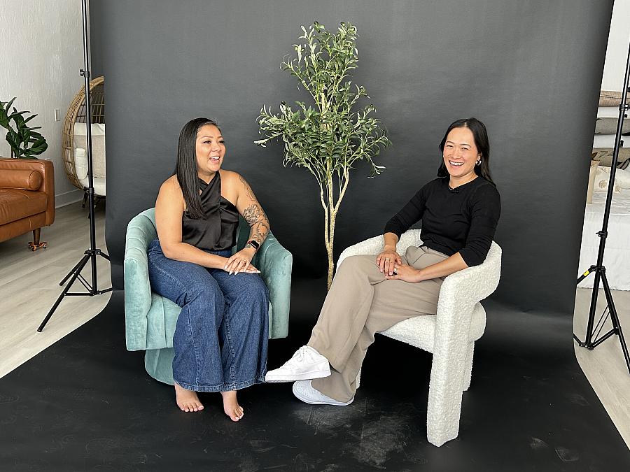 2 people seated on chairs