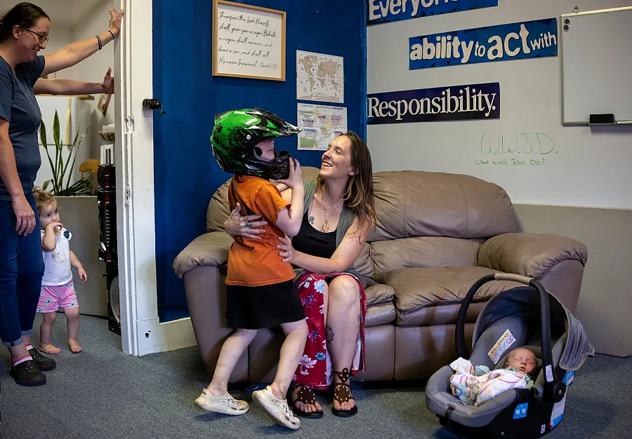 Courtney Johnson hugs her 6-year-old son, Scottie