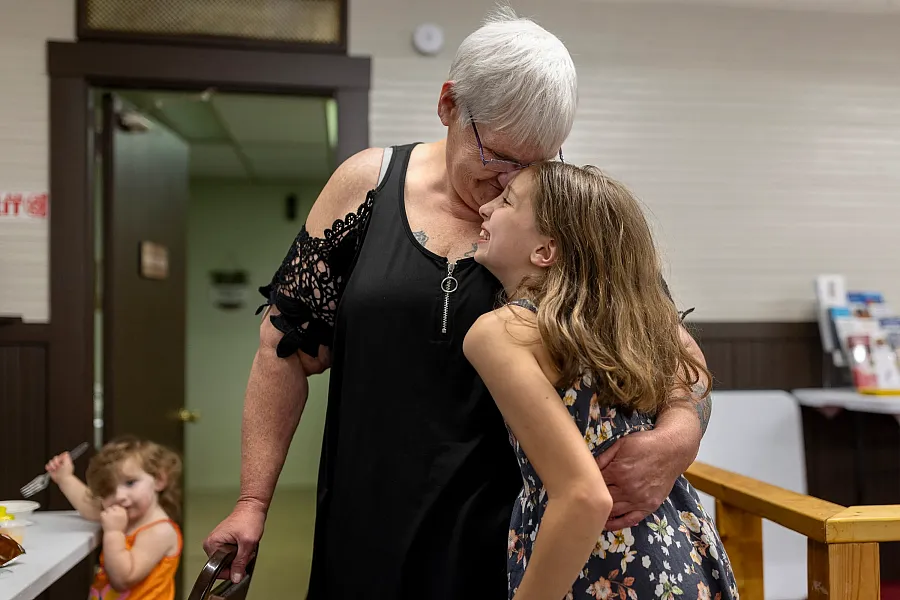 Michelle Williams hugs Ellianah Holtorf