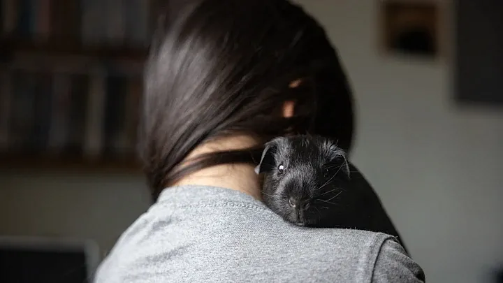 A women holds her family's pet 