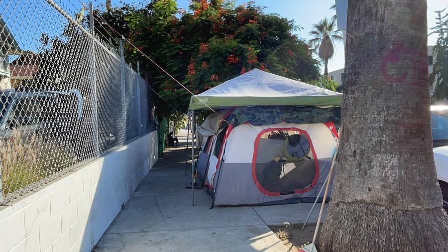 a tent against a fence