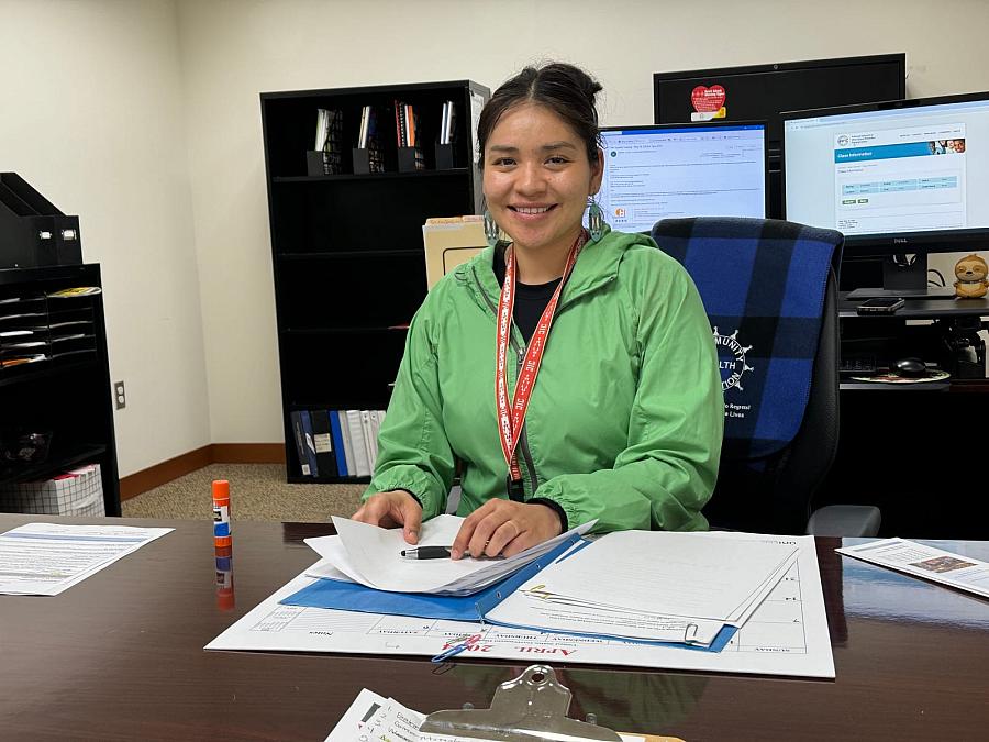 Person sitting with papers in front of them