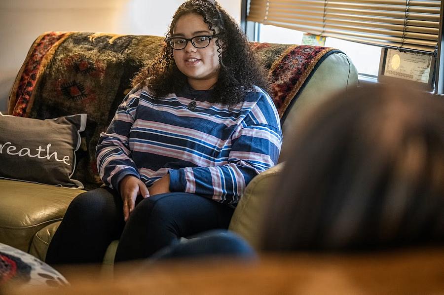 A girl sitting on a couch