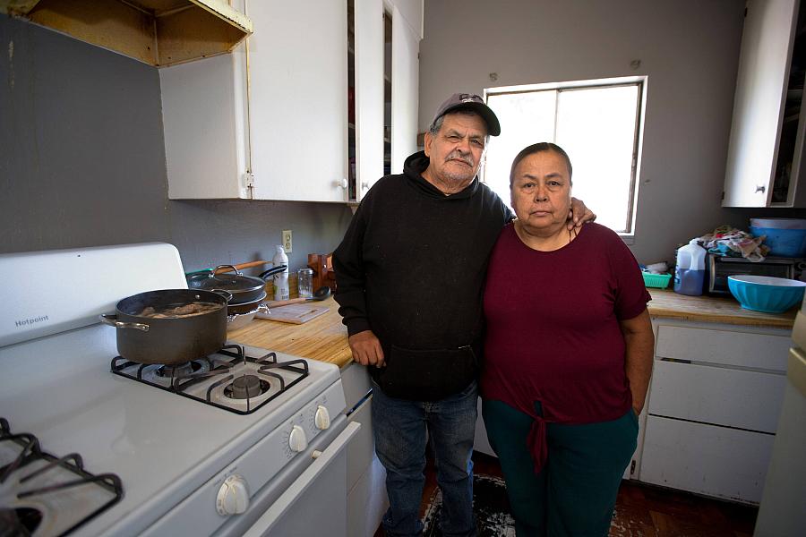 A man and a woman in kitchen