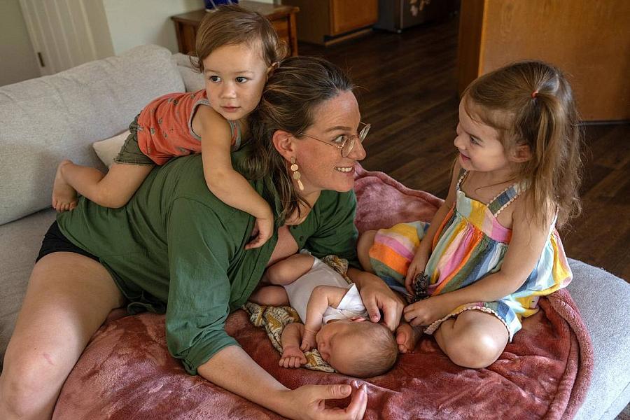 A mom playing with her 3 children