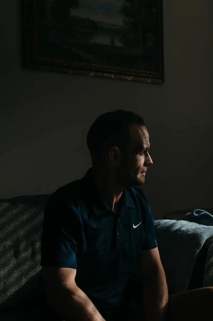 Devon sits in his apartment. 
