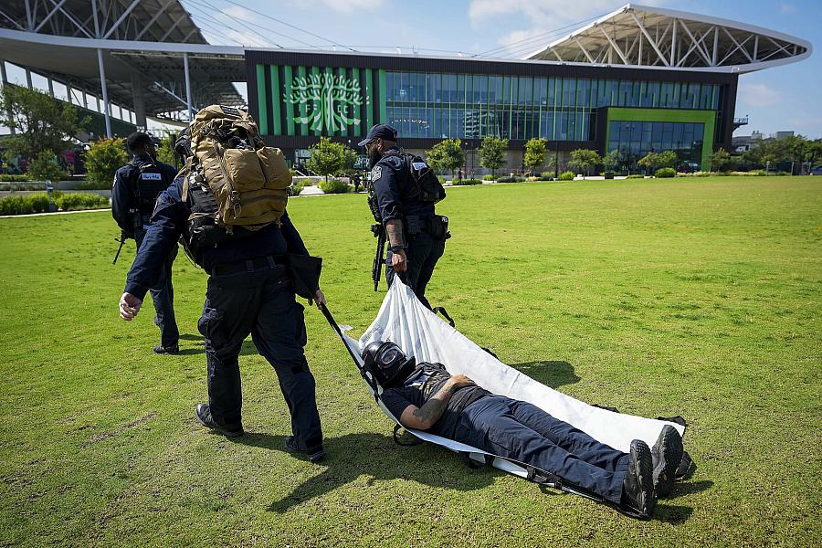 Image of paramedics carrying a victim