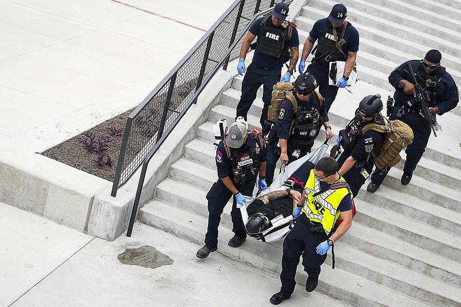 Image of paramedics carrying a victim