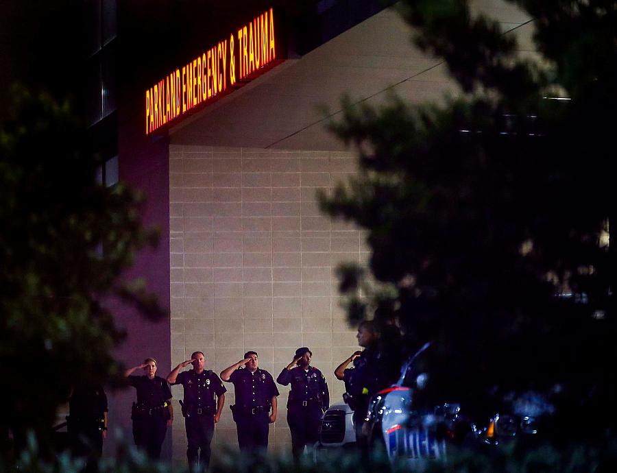 Image of police officers saluting