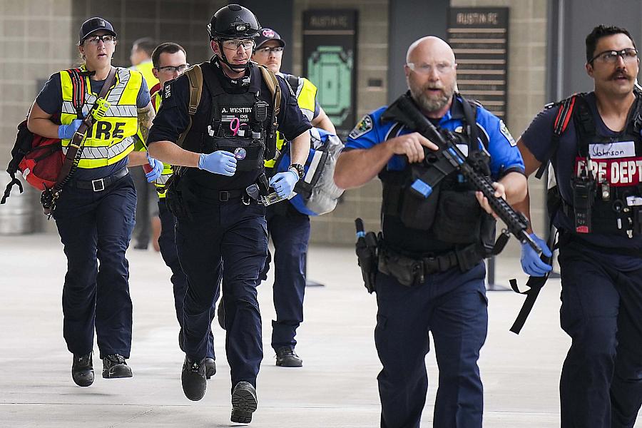 image of police officers running