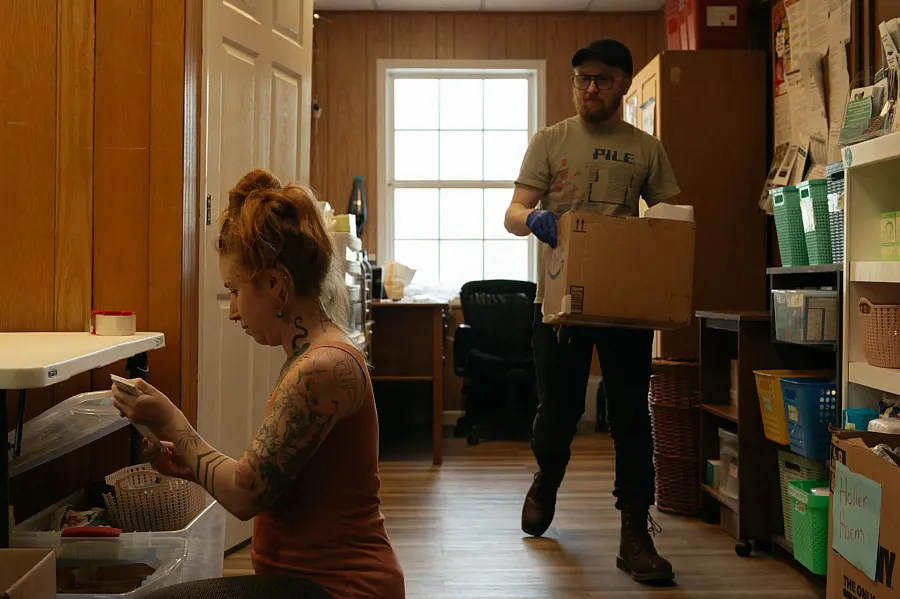 Two people packing kits