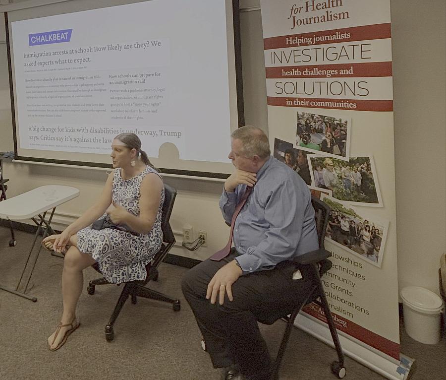Kalyn Belsha and Bruce Lesley speak to journalists in a room.