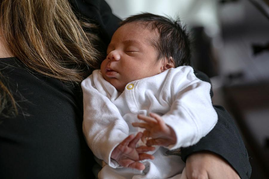 Baby in someone's arms