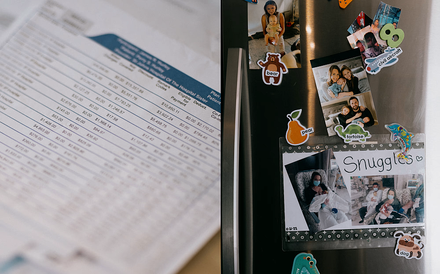 Photos pinned to a fridge alongside an image of a document