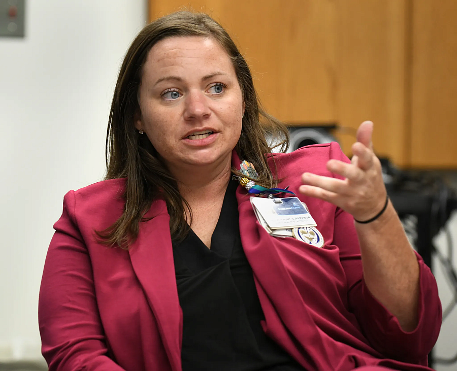 Person in a pink blazer