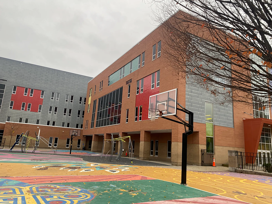 Building with basketball hoop in front of it