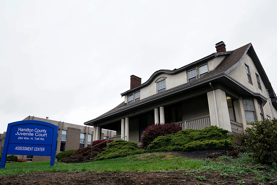 Building with a blue sign in front of it