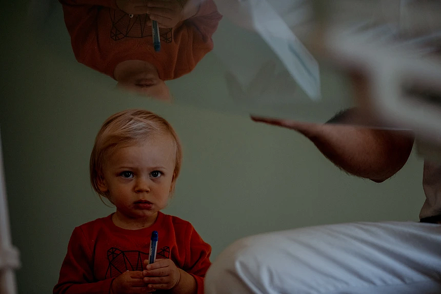 Child in an orange t-shirt